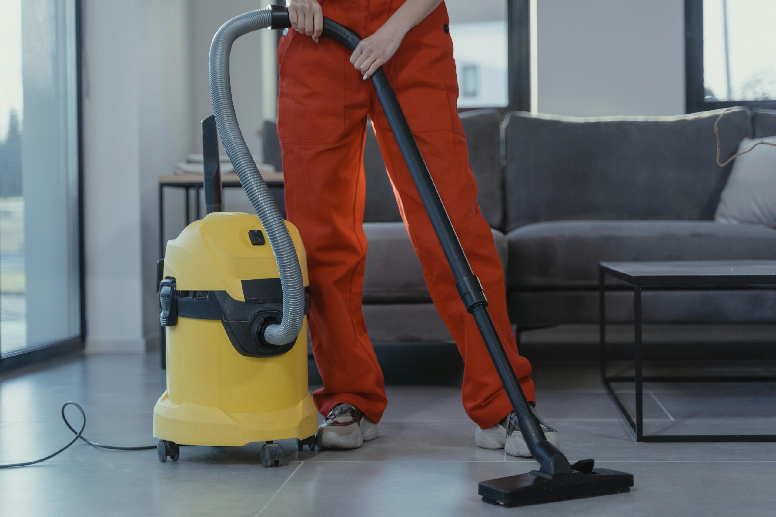 Professional cleaner vacuuming a modern interior with industrial equipment for commercial cleaning in Penguin